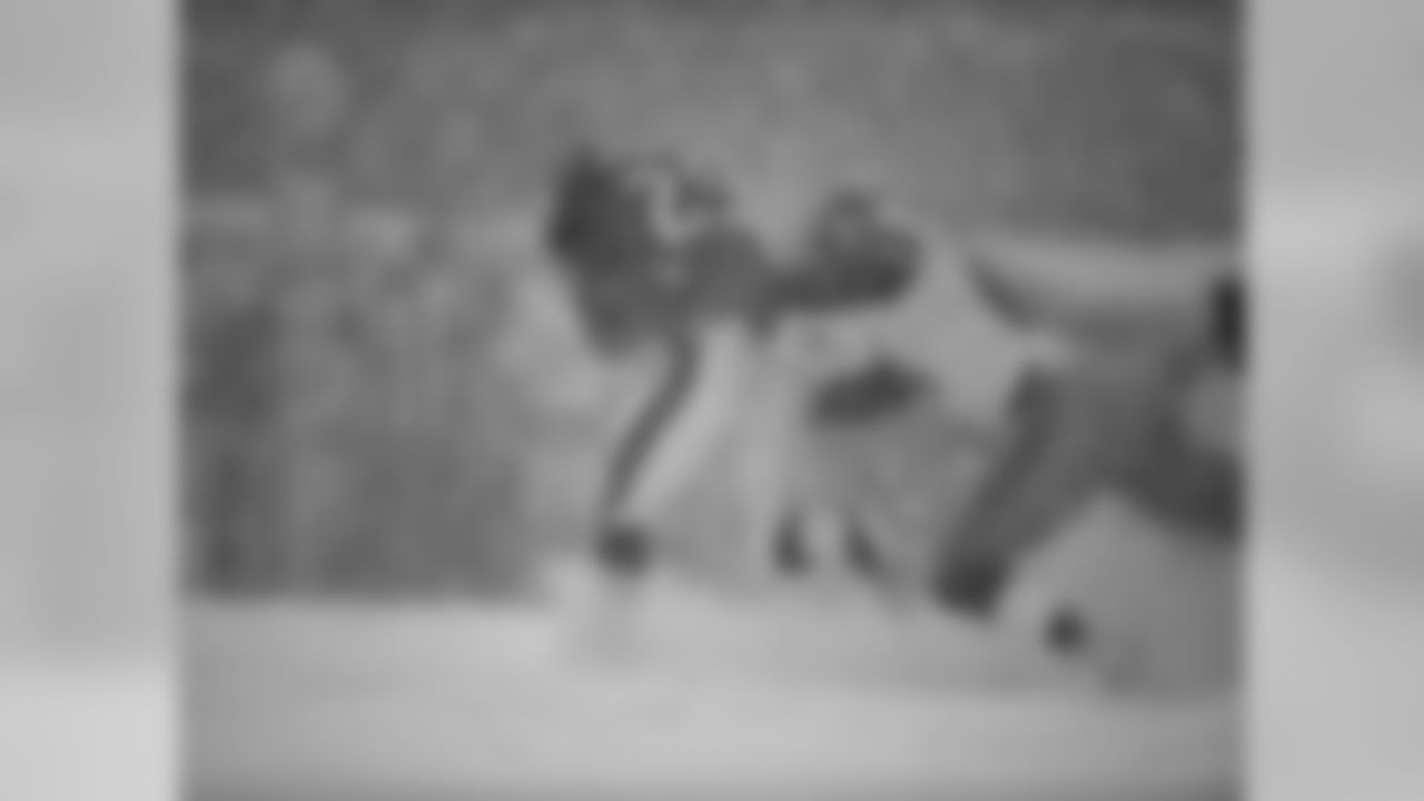 Eagles' RB LeSean McCoy gets tackled by Lions rookie DE Ezekiel Ansah.