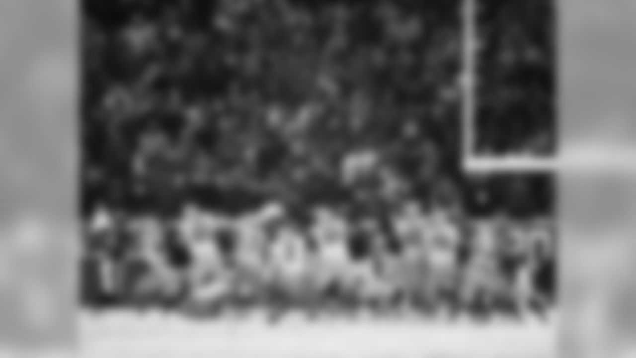Eagles' DT Bennie Logan blocks the PAT from Lions' kicker David Akers.