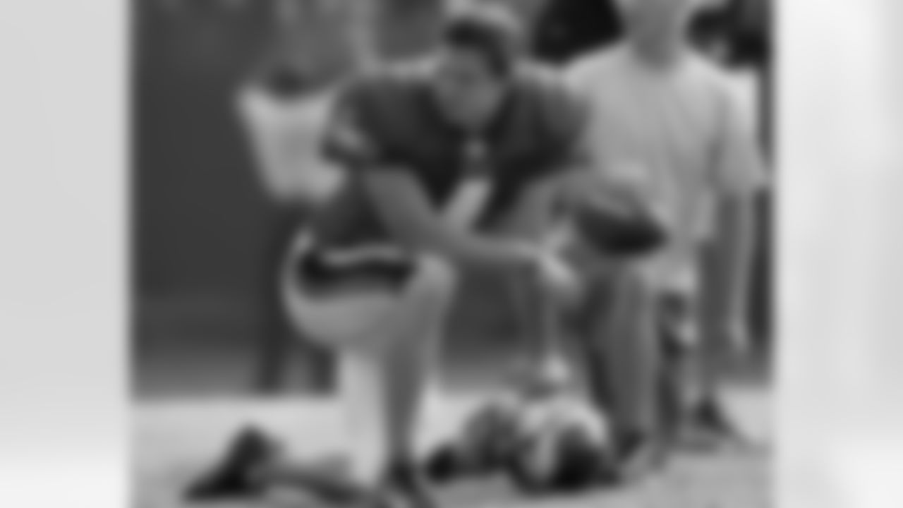 QB Kevin Kolb looks on