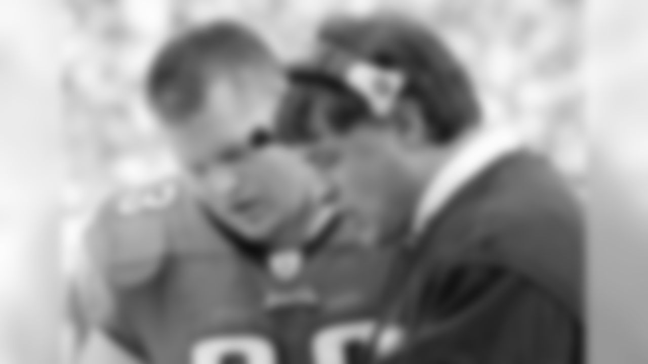 Hank Fraley and Coach Juan Castillo go over a play.