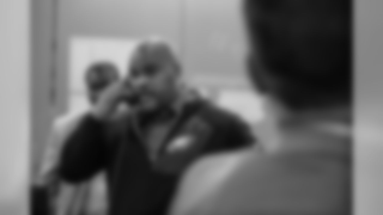 Assistant head coach/Running backs Duce Staley on the phone with Miles Sanders