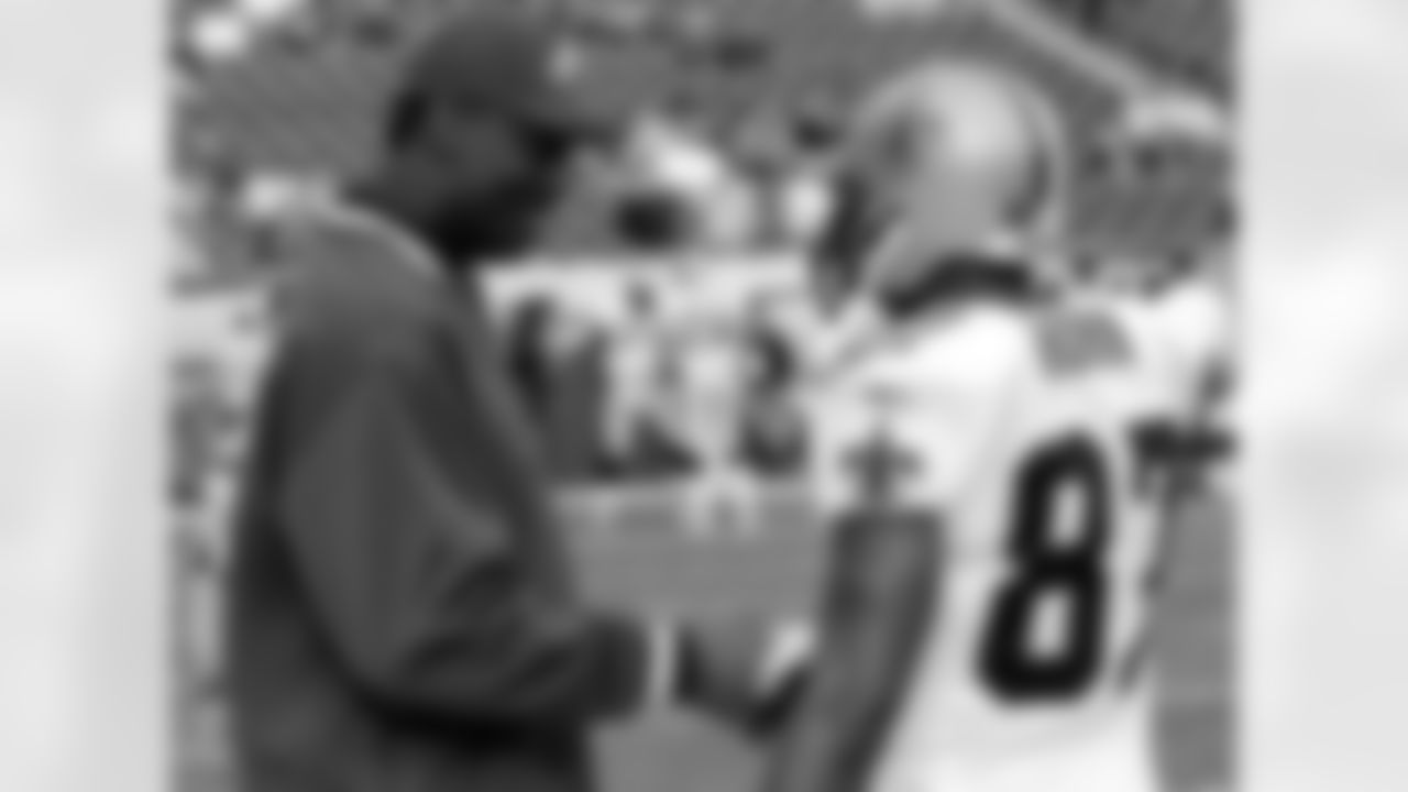 Eagles Director of Player Programs Harold Carmichael chats with Saints WR Joe Horn.