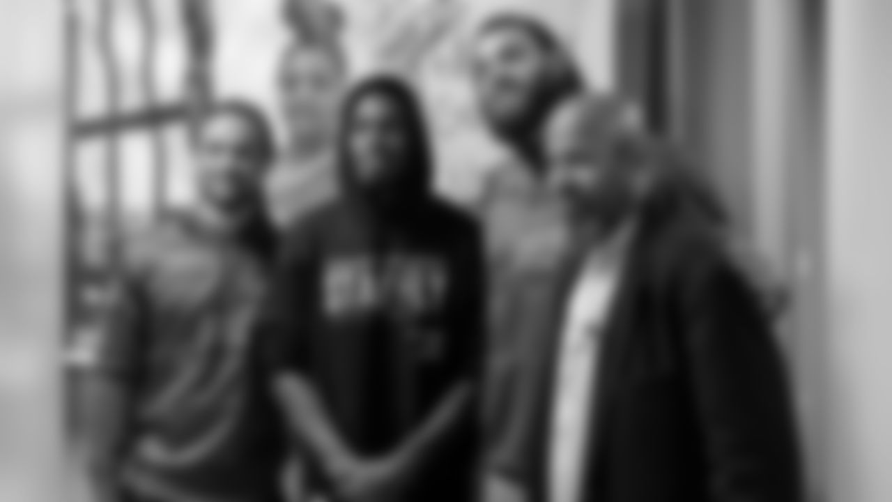 Avonte Maddox, Chandon Sullivan, and Dallas Goedert with a fan