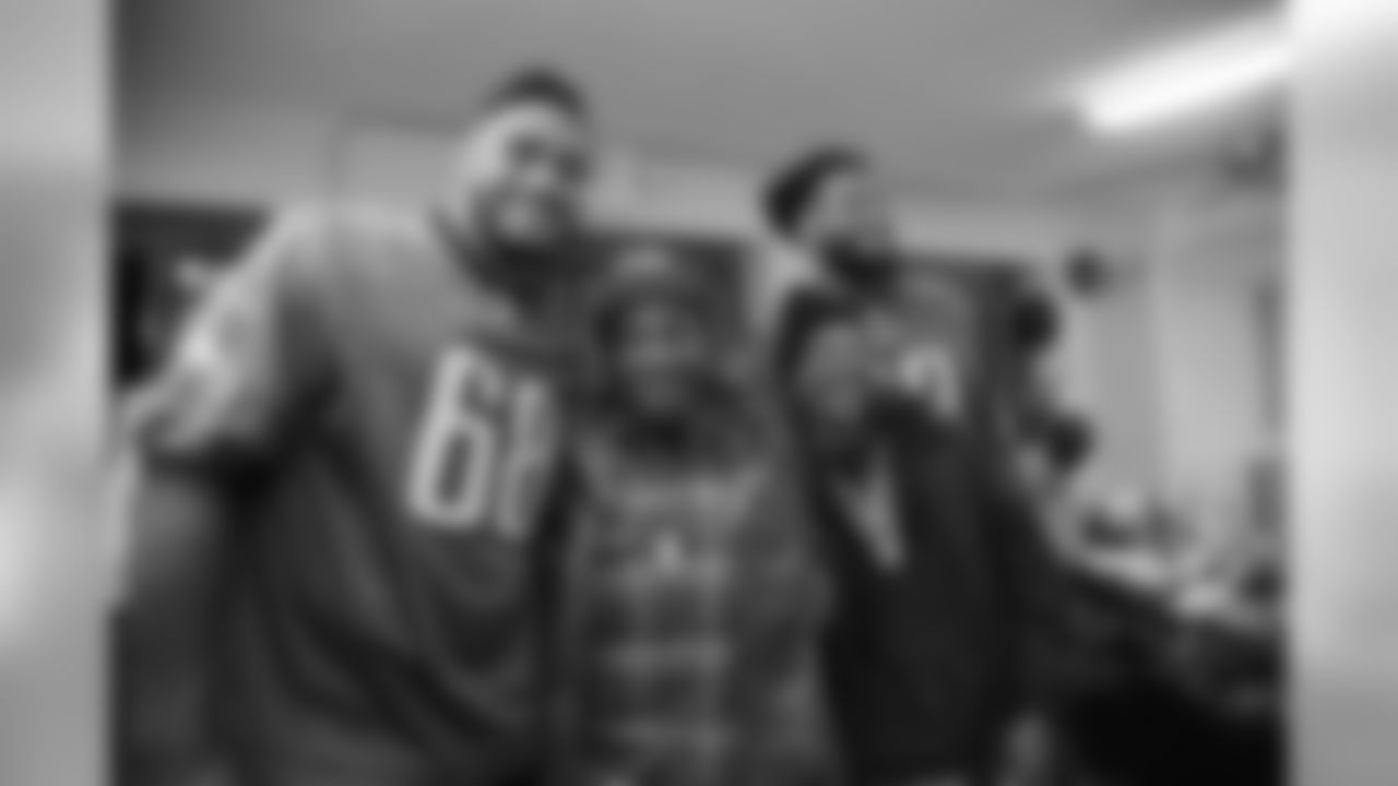 Jordan Mailata and Matt Pryor with a happy family