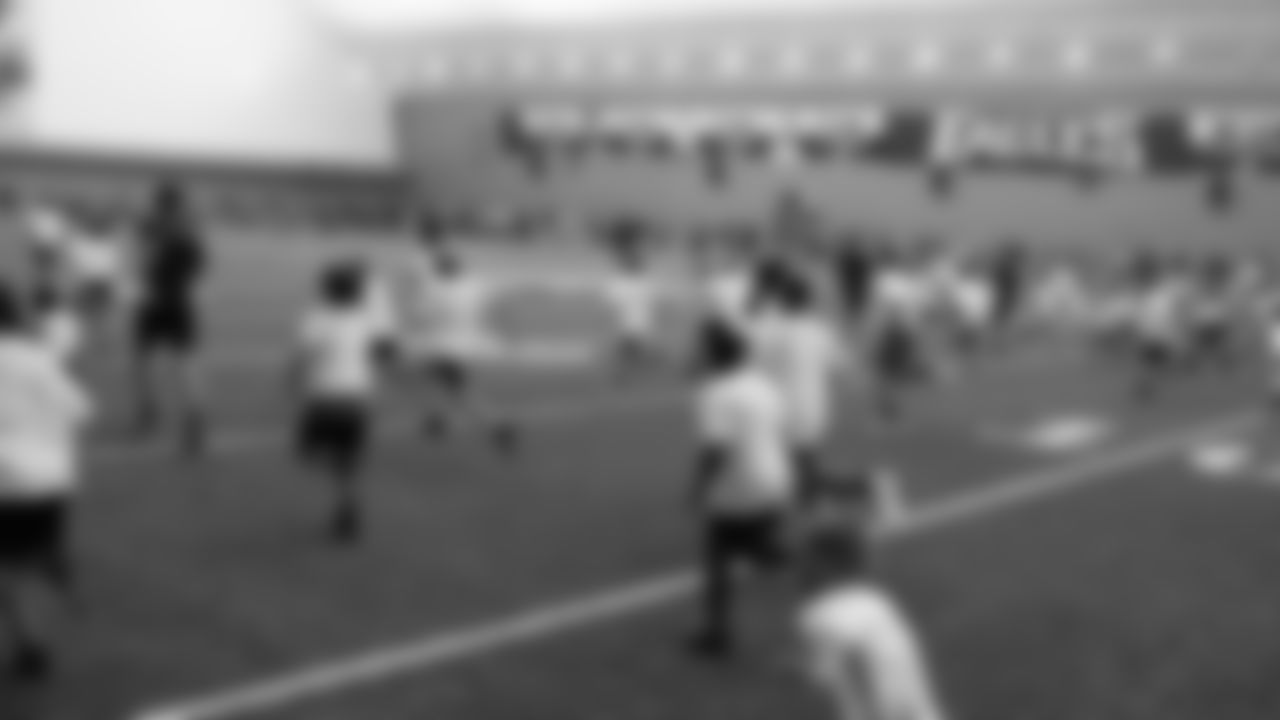 The children were grouped by age and were taught football skills and fundamentals