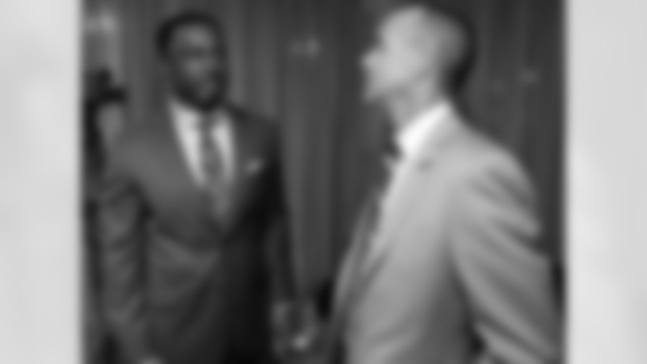 Eagles President Don Smolenski chats with former Eagles safety Brian Dawkins.