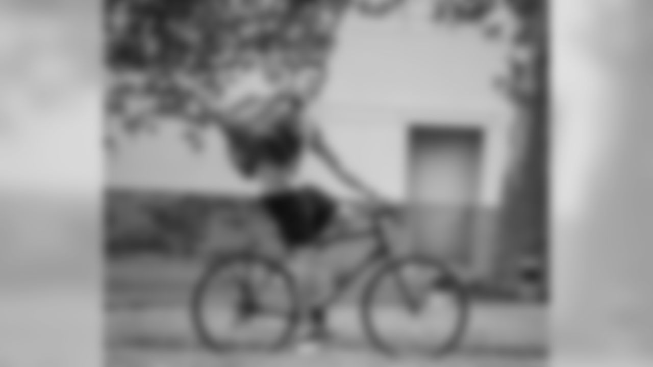 WR Mack Hollins arriving to training camp on his bicycle