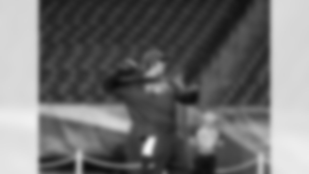 Eagles' QB Nick Foles throws a pass before the game.