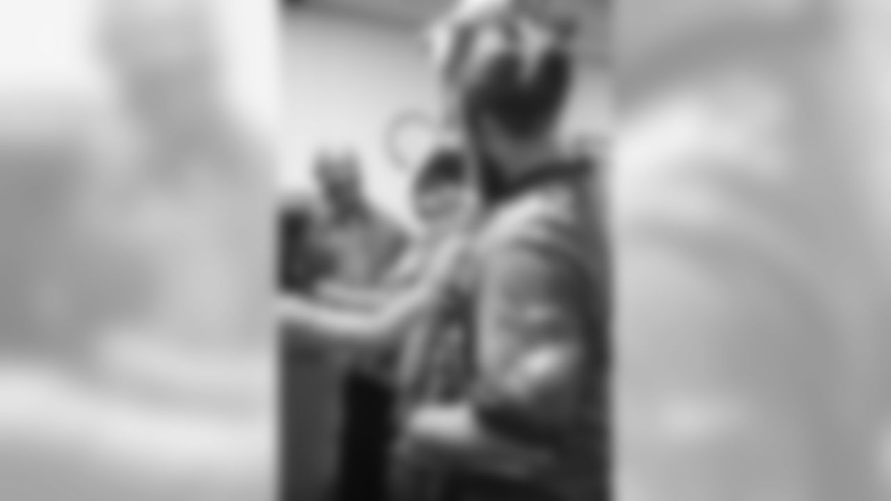 Jason Kelce meets SrA Tariq Fladger's 1-year-old son prior to the surprise