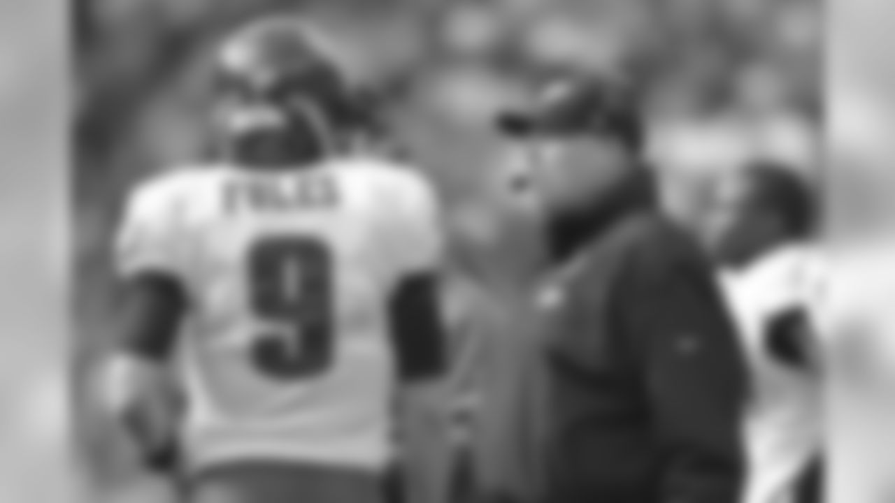 QB Nick Foles talks with head coach Andy Reid