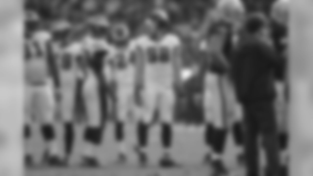 Eagles' defenders prepare for the upcoming Raiders play.