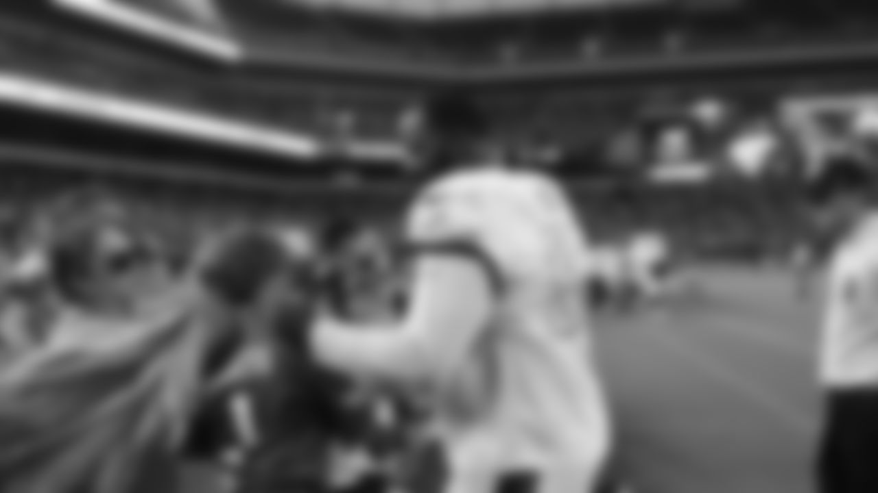 Fletcher Cox signs autographs.