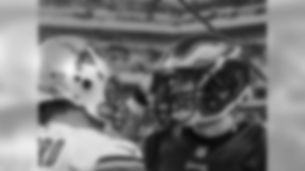 Eagles' QB Nick Foles and Lions' QB Matthew Stafford shake hands after the game.