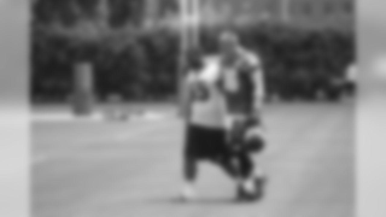 LB Brandon Graham and TE Zach Ertz walk off the field