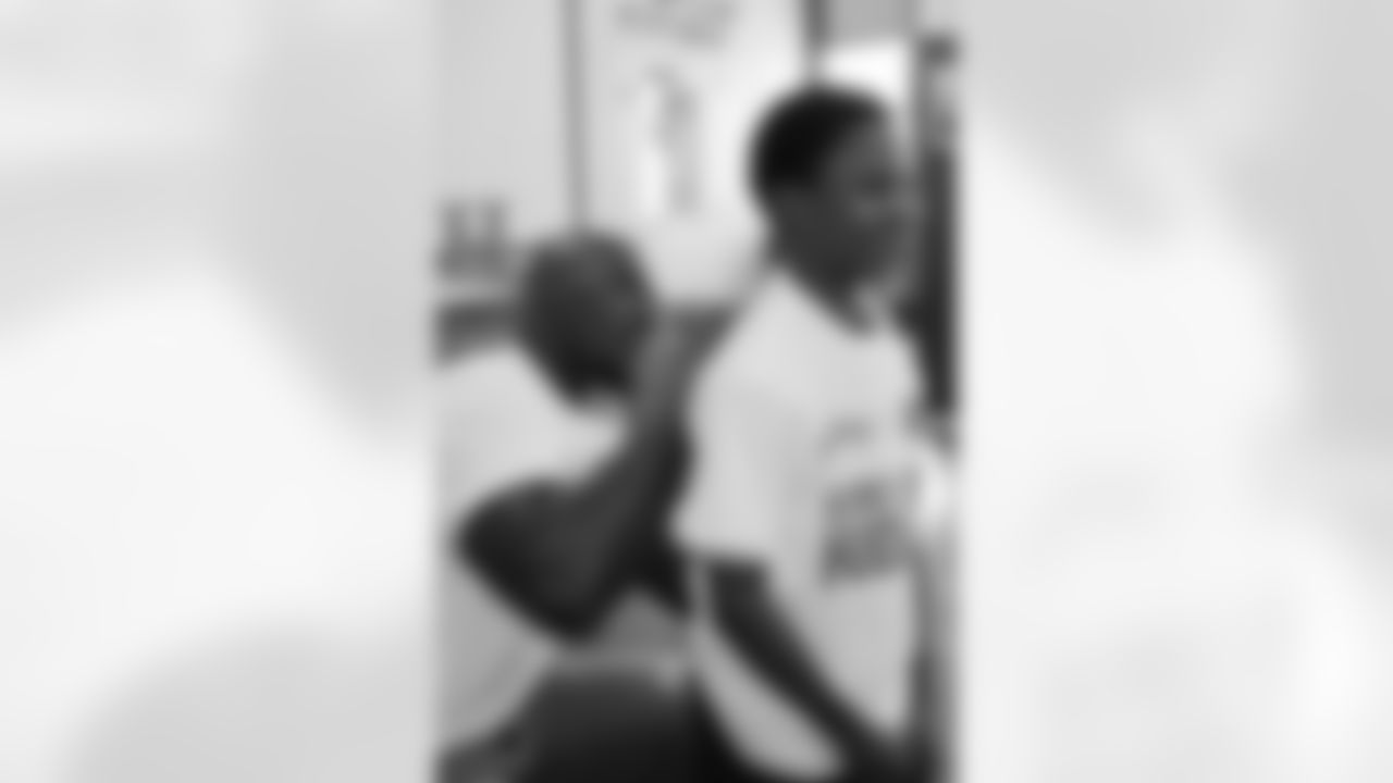 DeMeco Ryans autographed each student's t-shirt, ensuring they would return home with a special momento from the day