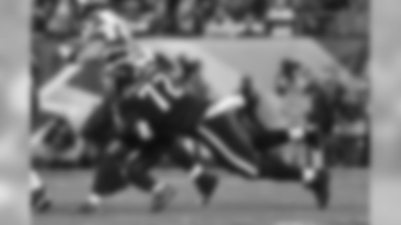 DE Cedric Thornton diving the make the tackle