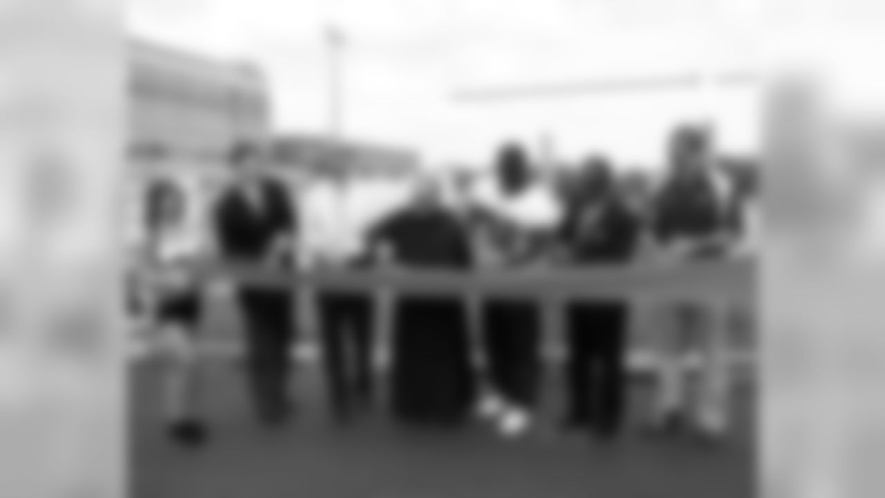 Representatives of the Eagles, the NFL Grassroots Program, LISC and Monsignor Bonner HS cut the ribbon to unveil its newly refurbished synthetic field