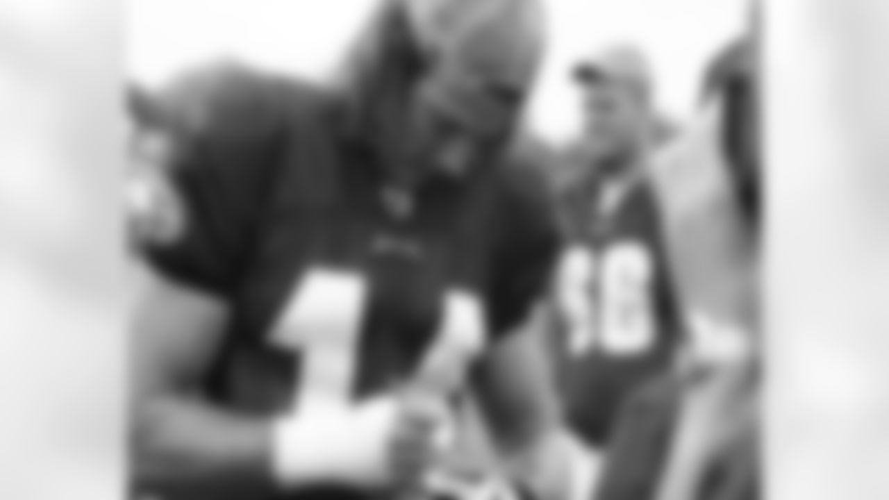 WR Riley Cooper signs a football