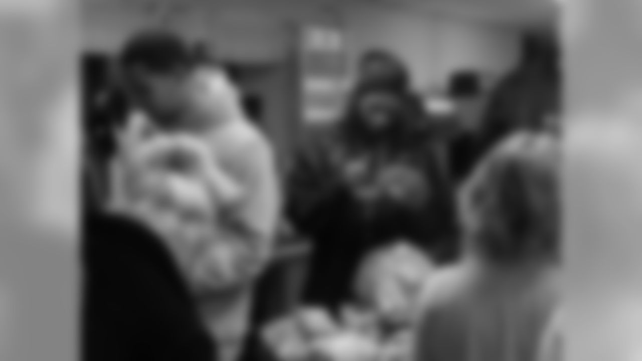 Clay Harbor, #82, and Trevard Lindley, #35, sign autographs.