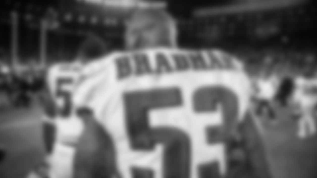 LB Nigel Bradham runs on the field following the win