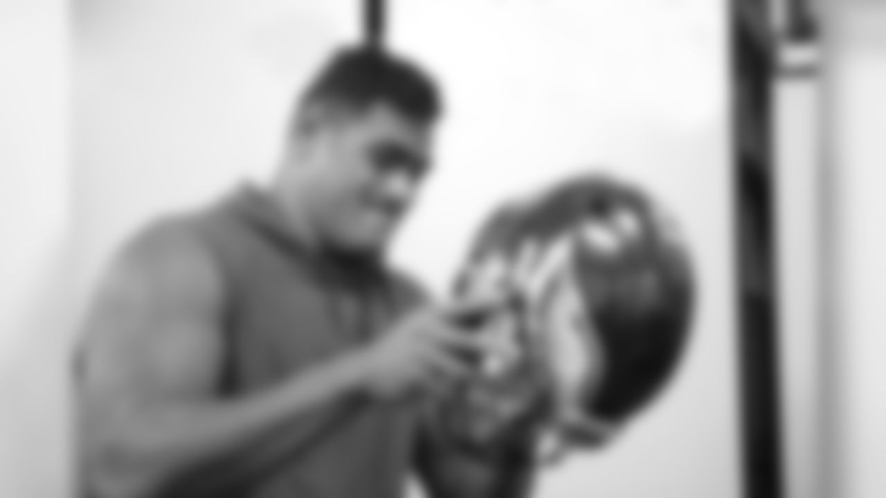 Mailata tries on an Eagles helmet for the first time.