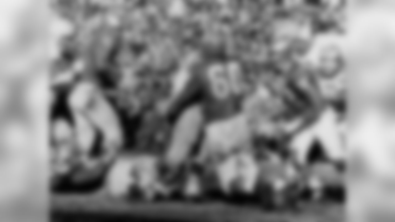 "Concrete" Chuck Bednarik tackles a member of the Packers in 1960