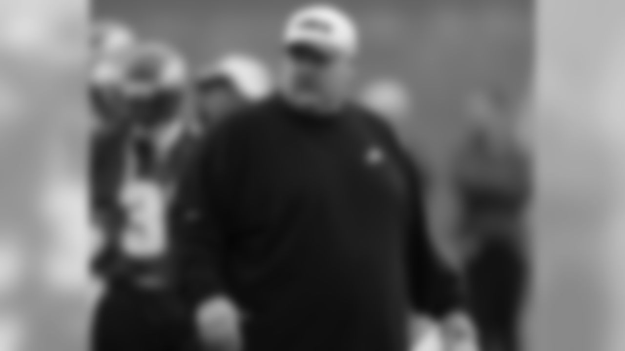 Andy Reid observes the team