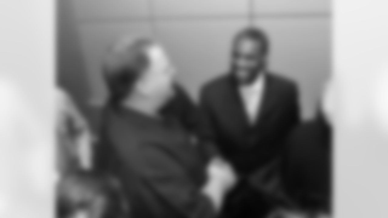 Head coach Andy Reid shakes the hand of Samuel's agent, Alonzo Shavers