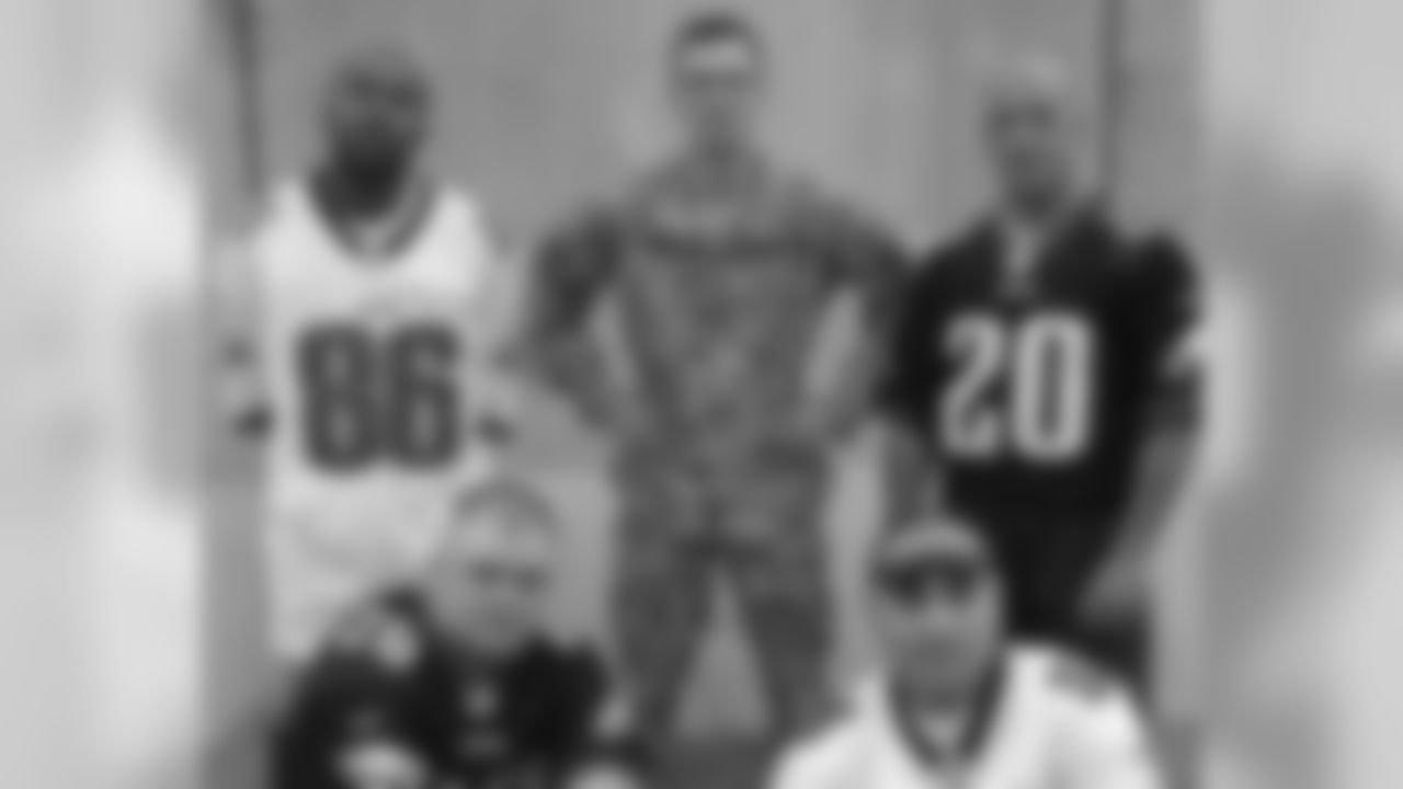 Eagles fans MSG Pollino, SSG Ridgick, SGT Girou, SGT Bowe, SPC Santiago, SPC Medina and SPC St. Fort show their support while in Iraq