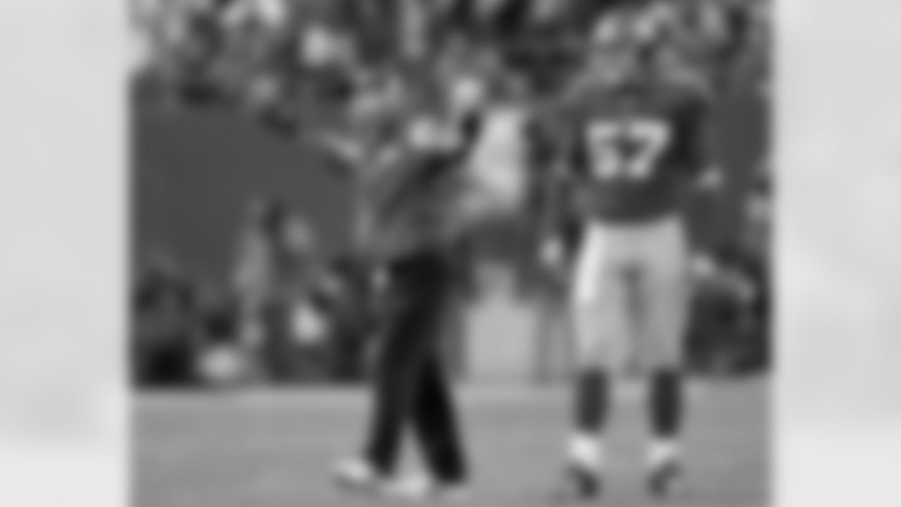 Giants coach Tom Coughlin questions a call