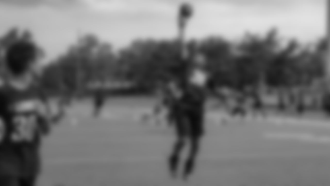 A camp participant catches a ball