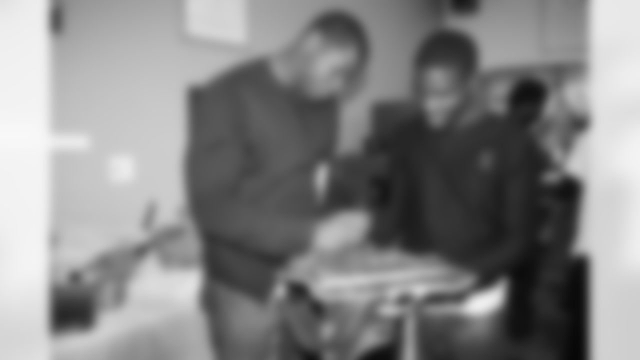 TE Cornelius Ingram #88 signs autographs for the youth