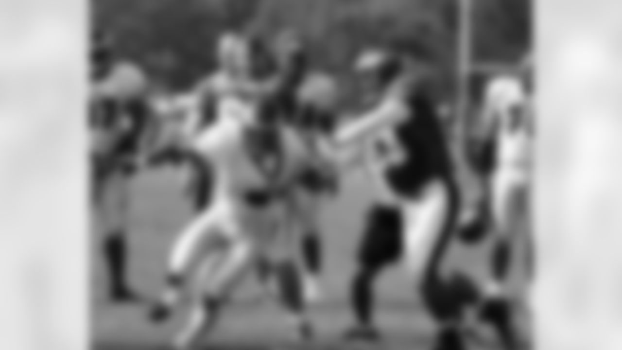 DE Jason Babin works against OL Paul Fanaika in one-on-one drill