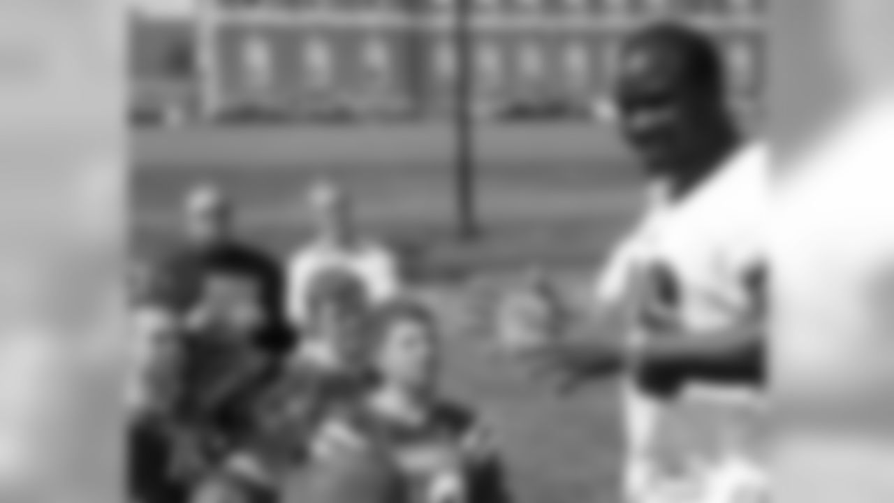 LB Omar Gaither talks with members of the Bonner football team