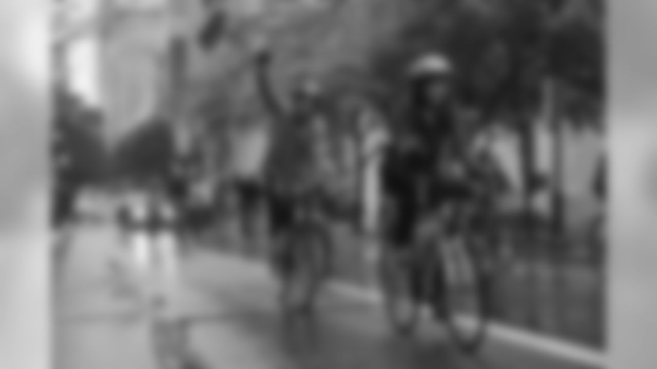 A rider pumps his fist.