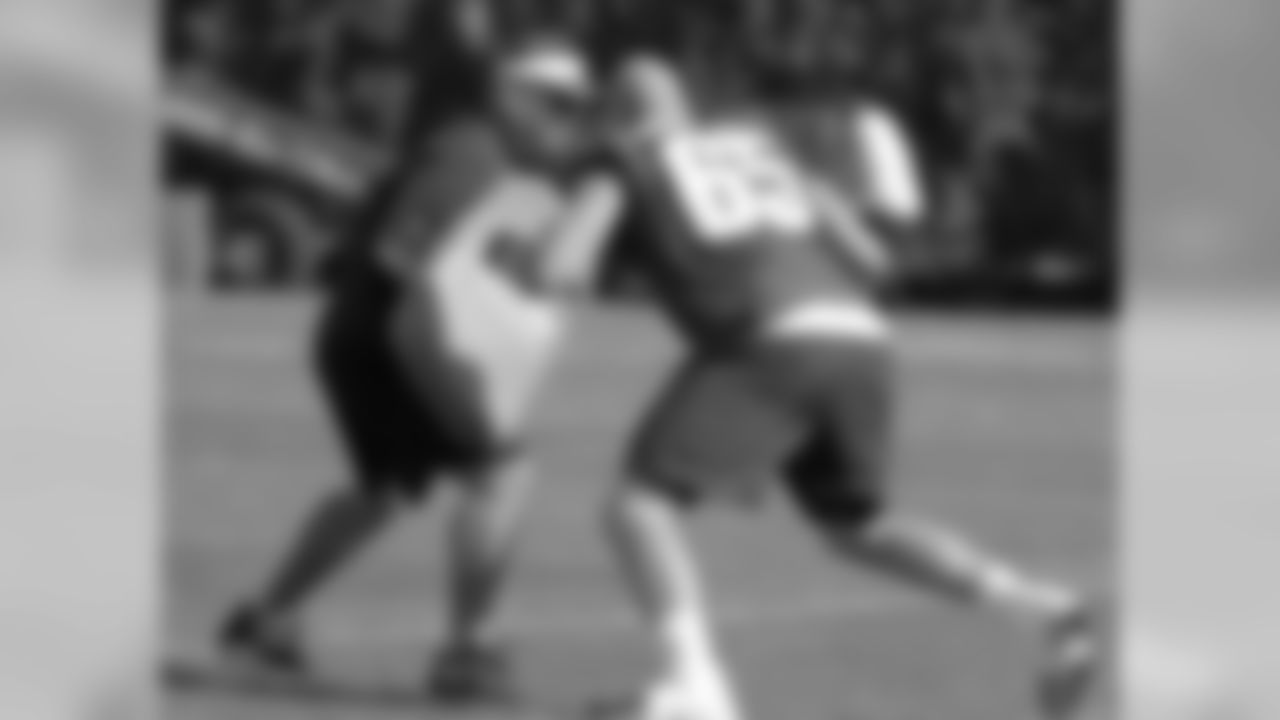 T Lane Johnson working with offensive line coach Jeff Stoutland after practicee