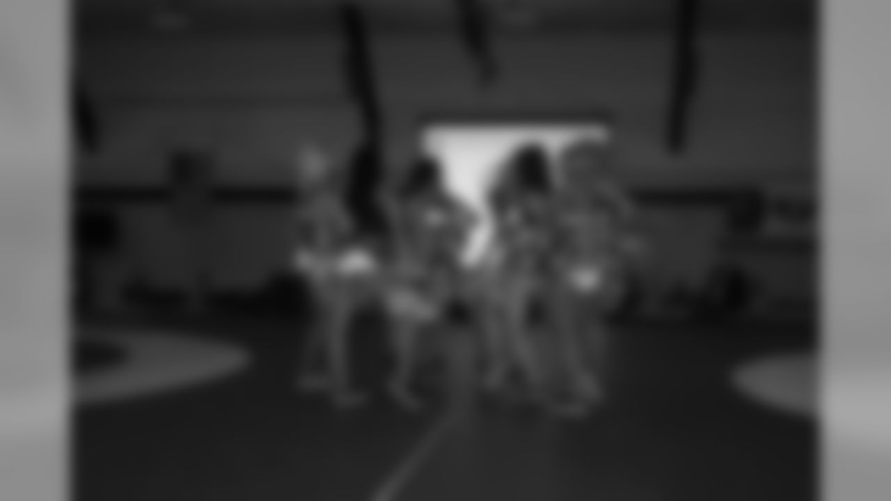 The cheerleaders are used to performing on the field, not a wrestling mat