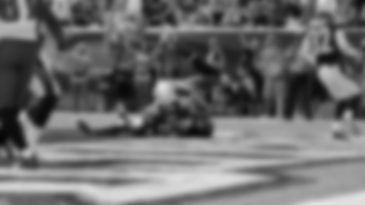 Eagles' wide receiver Riley Cooper tumbles t o the ground after making his touchdown reception in the first half of Sunday's game.