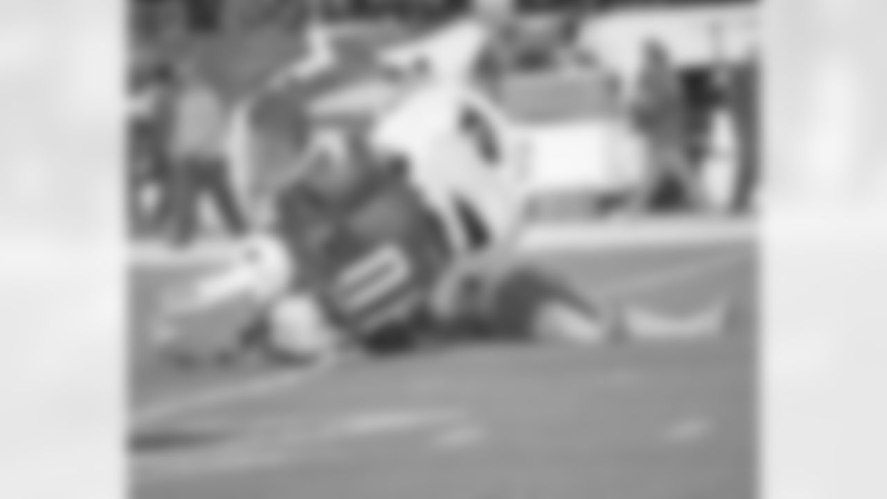 Inflatable SWOOP pounces on a Cardinal during pre-game activities