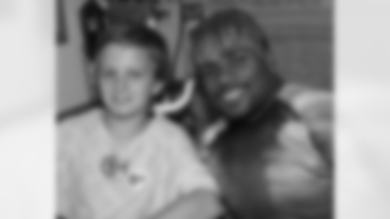 S Quintin Demps hangs with one of the patients