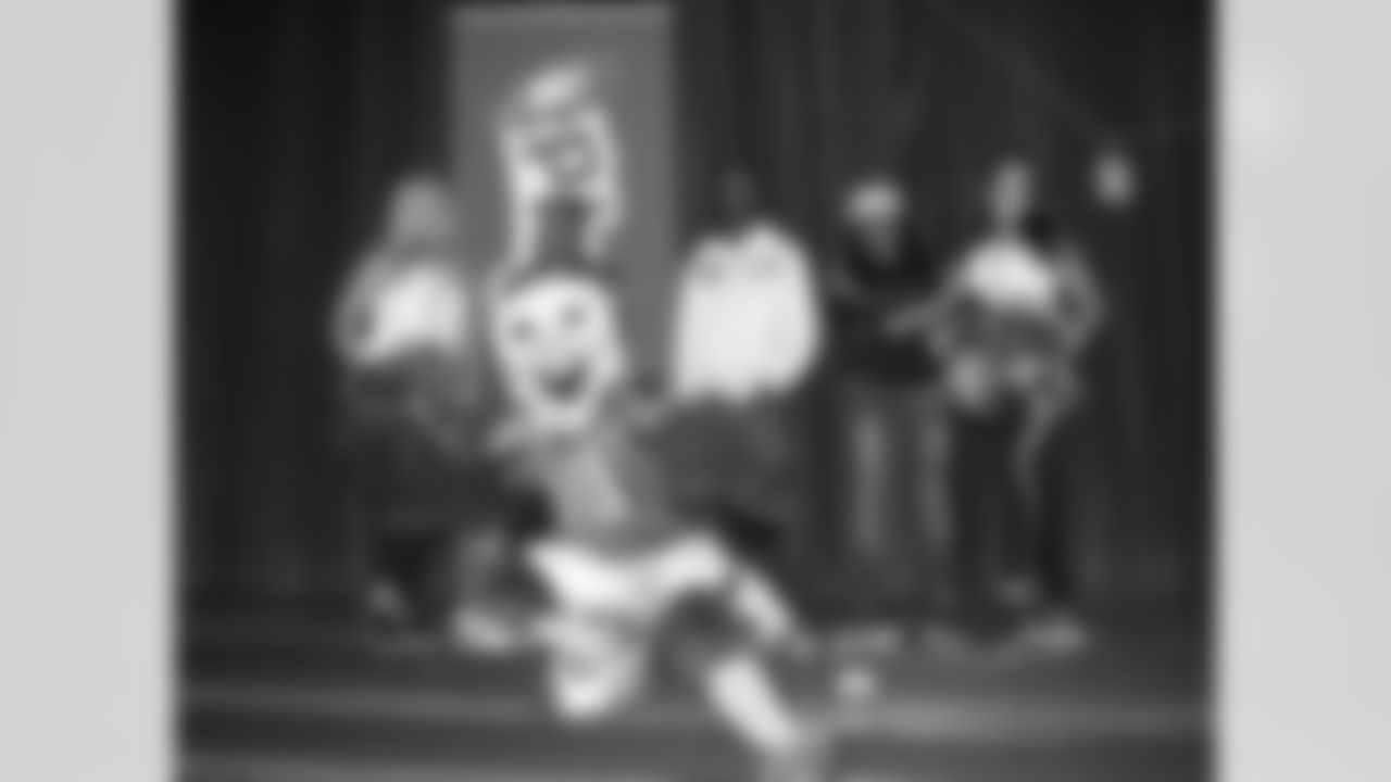 A few students pose with SWOOP and the Eagles cheerleaders