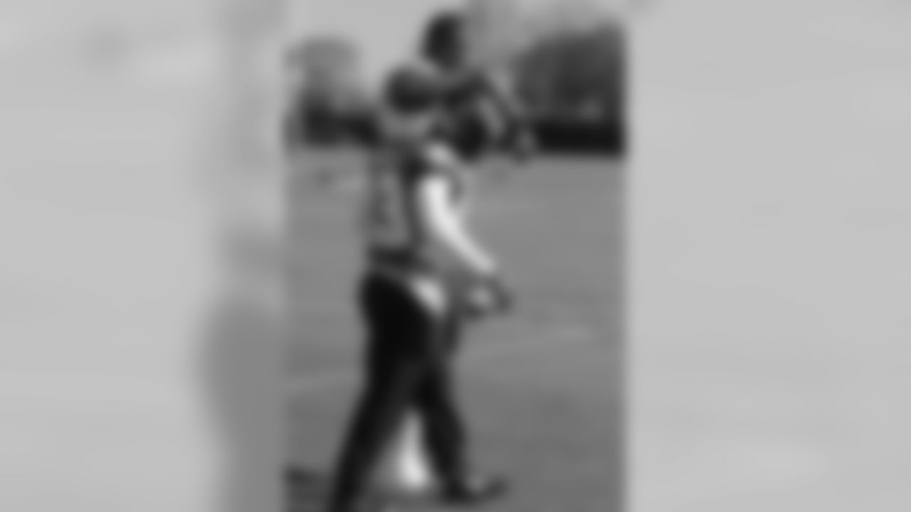 DE Fletcher Cox walking out with RB Darren Sproles