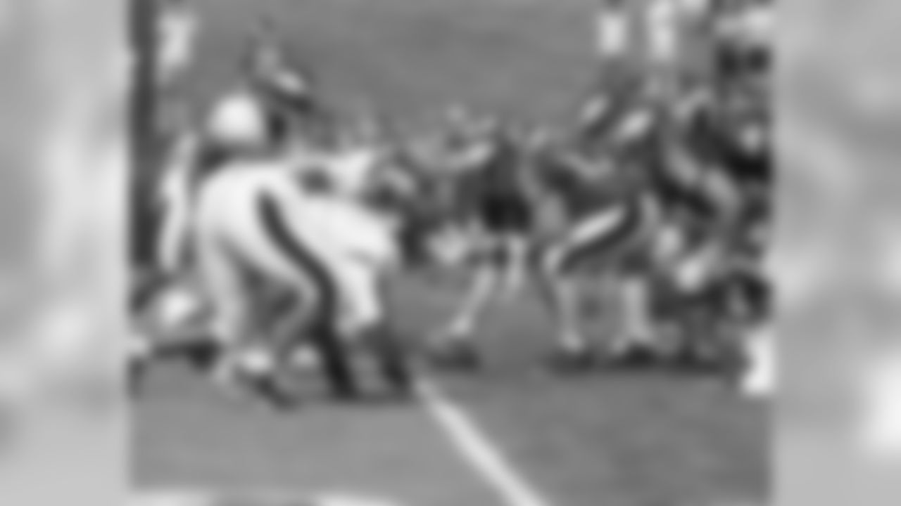 The center is set to snap the football
