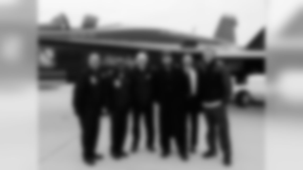 President Don Smolenski, Dave Spadaro, LS Jon Dorenbos and QB Matt Barkley pose with one of the Blue Angels pilots