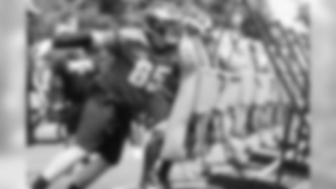OT Lane Johnson hits the blocking sled.