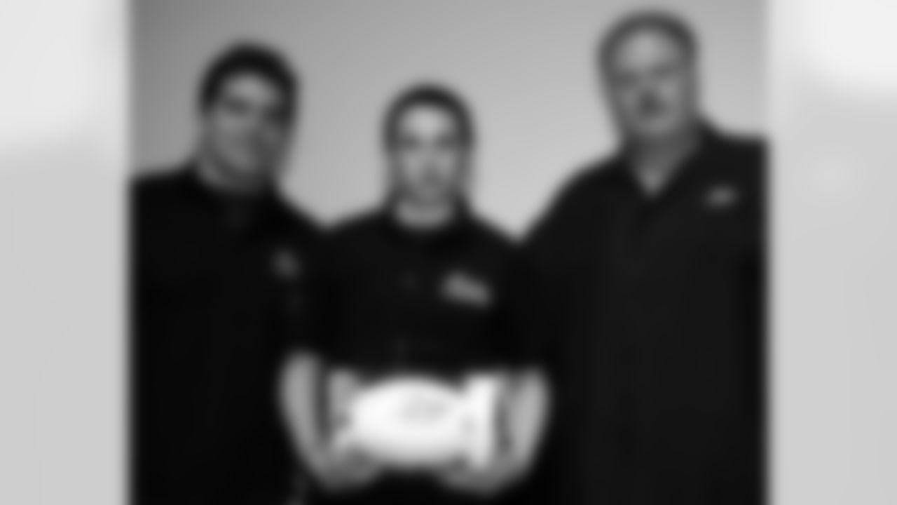 Michael Rivera of Central High School with Andy Reid and Kyle Eckel