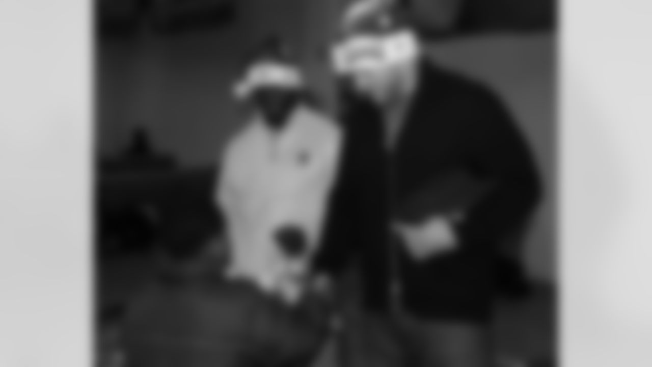 The Eagles kicked off their Holiday Book And Toy Drive Wednesday as Omar Gaither and Todd Herremans handed out gifts at the Tucker PAL