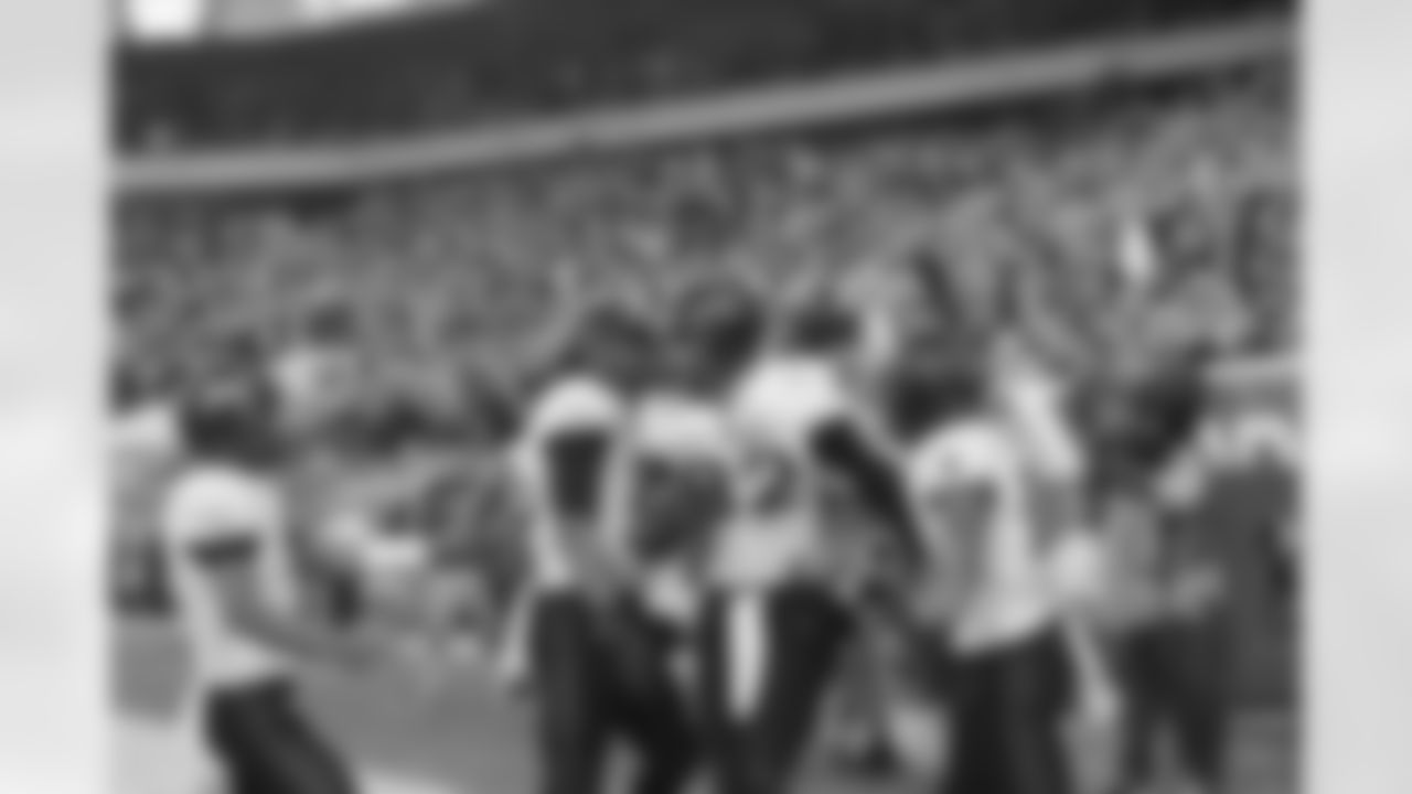 Army players congratulate Poe