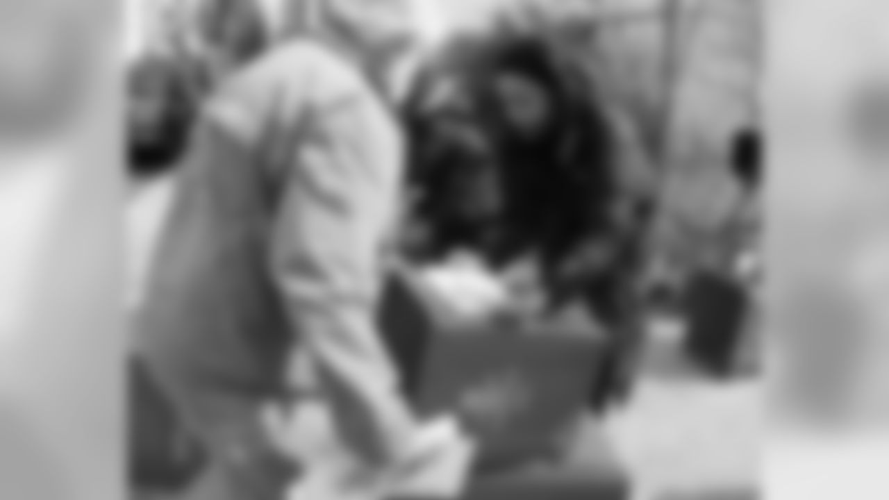 Eagles Sr. Vice President of Public Affairs Pamela Browner-Crawley helps get the bins ready to hand out