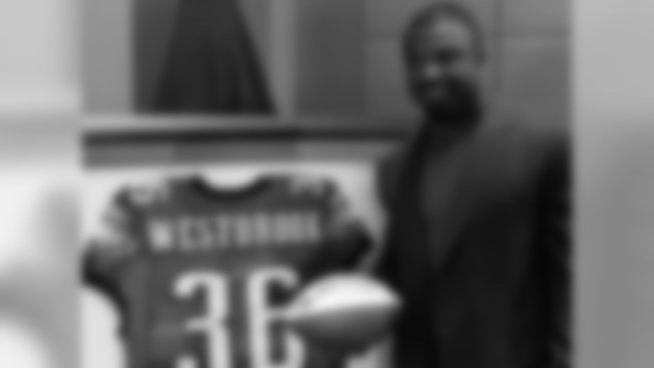 Brian Westbrook poses with his game ball and jersey